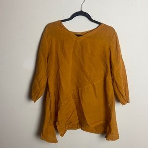 100% cotton, mustard yellow. Gently worn. Cut tag out because it was itching me